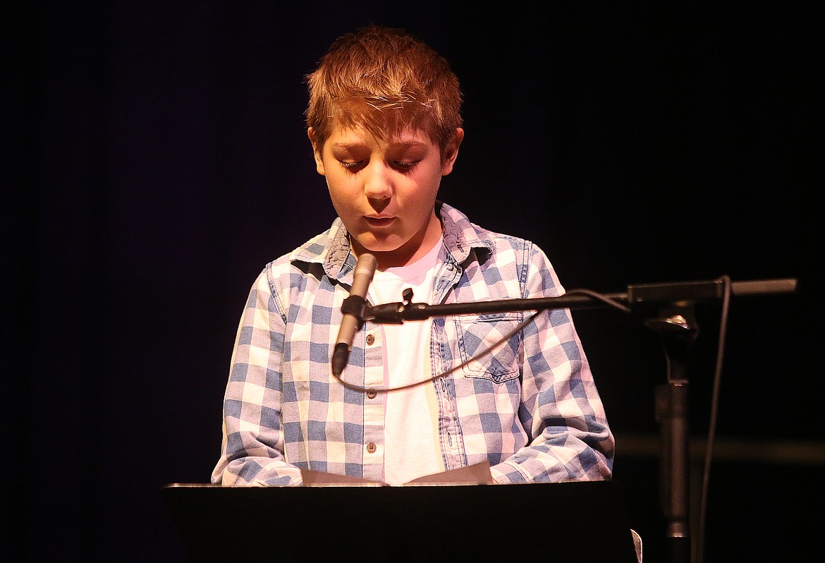 Bryan Elementary School student William Severinsen  reads his essay during the 35th Annual Human Rights Celebration assembly in the Schuler Auditorium at NIC. (LOREN BENOIT/Press)