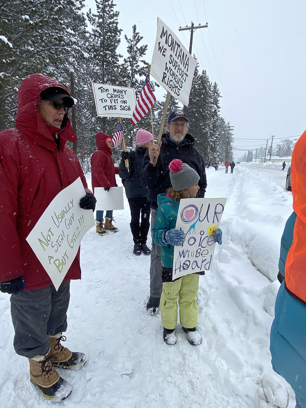 (Photo by CAROLINE LOBSINGER)
A few of the participants at the N. Idaho Women&#146;s March brave the cold and snow to march through the streets call attention to women&#146;s rights, human rights and social justice.