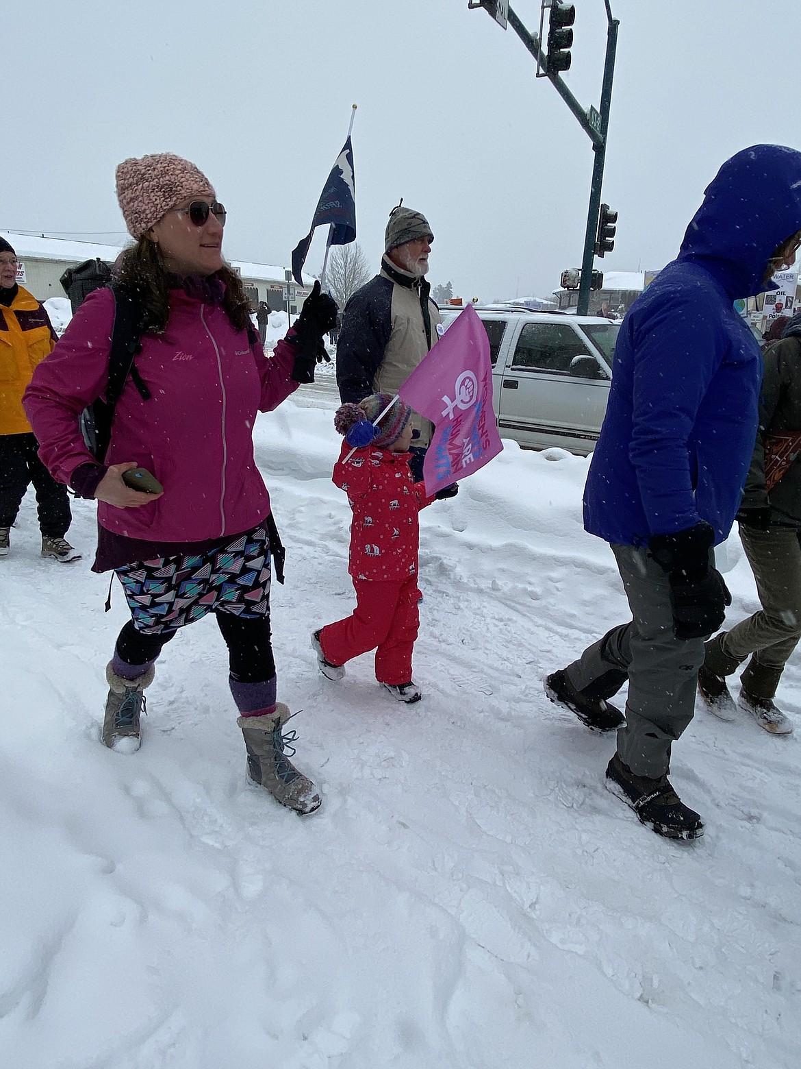 (Photo by CAROLINE LOBSINGER)
A few of the participants at the N. Idaho Women&#146;s March brave the cold and snow to march through the streets call attention to women&#146;s rights, human rights and social justice.