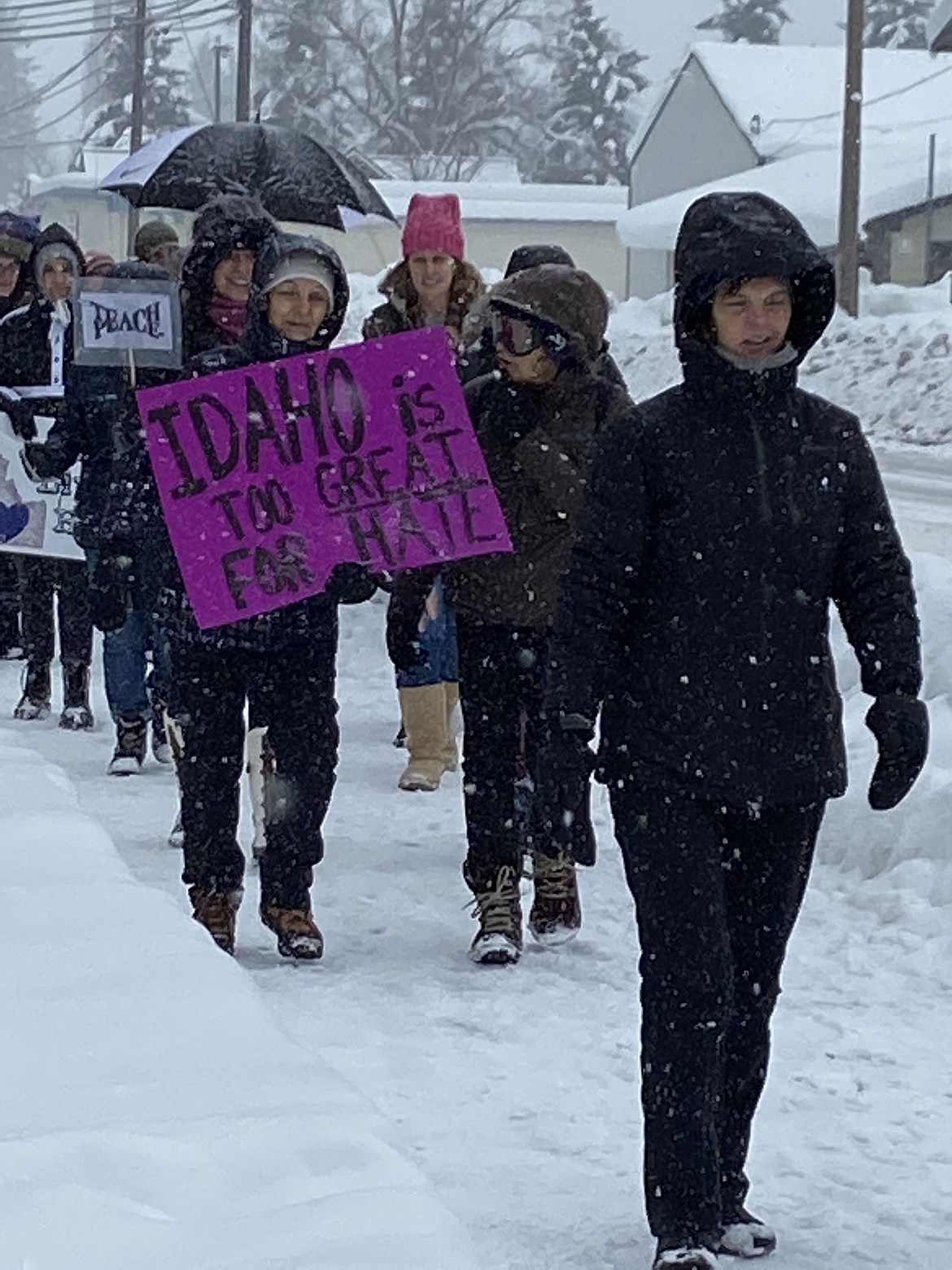 (Photo by CAROLINE LOBSINGER)
A few of the participants at the N. Idaho Women&#146;s March brave the cold and snow to march through the streets call attention to women&#146;s rights, human rights and social justice.