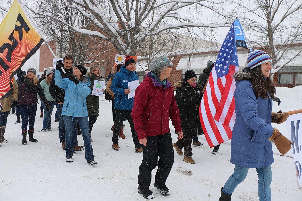 (Photo by CAROLINE LOBSINGER)
A few of the participants at the N. Idaho Women&#146;s March brave the cold and snow to march through the streets call attention to women&#146;s rights, human rights and social justice.