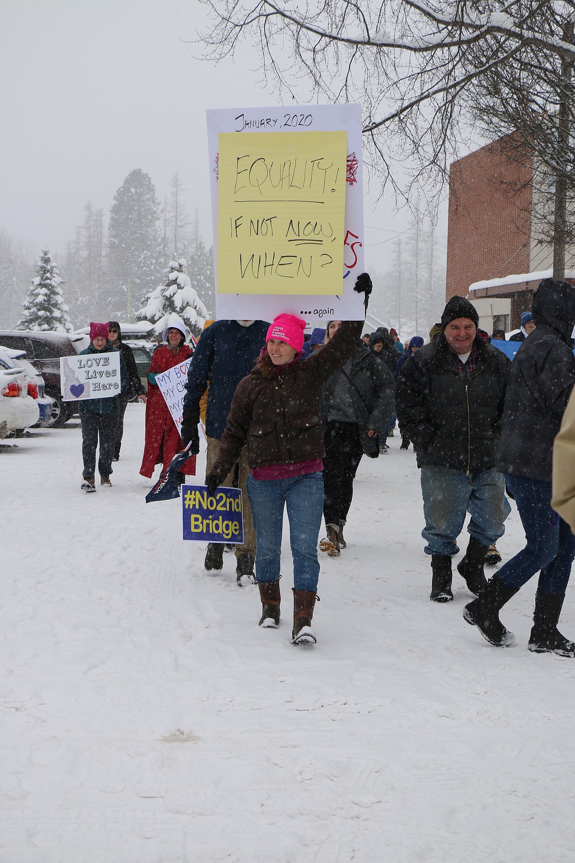 (Photo by CAROLINE LOBSINGER)
A few of the participants at the N. Idaho Women&#146;s March brave the cold and snow to march through the streets call attention to women&#146;s rights, human rights and social justice.