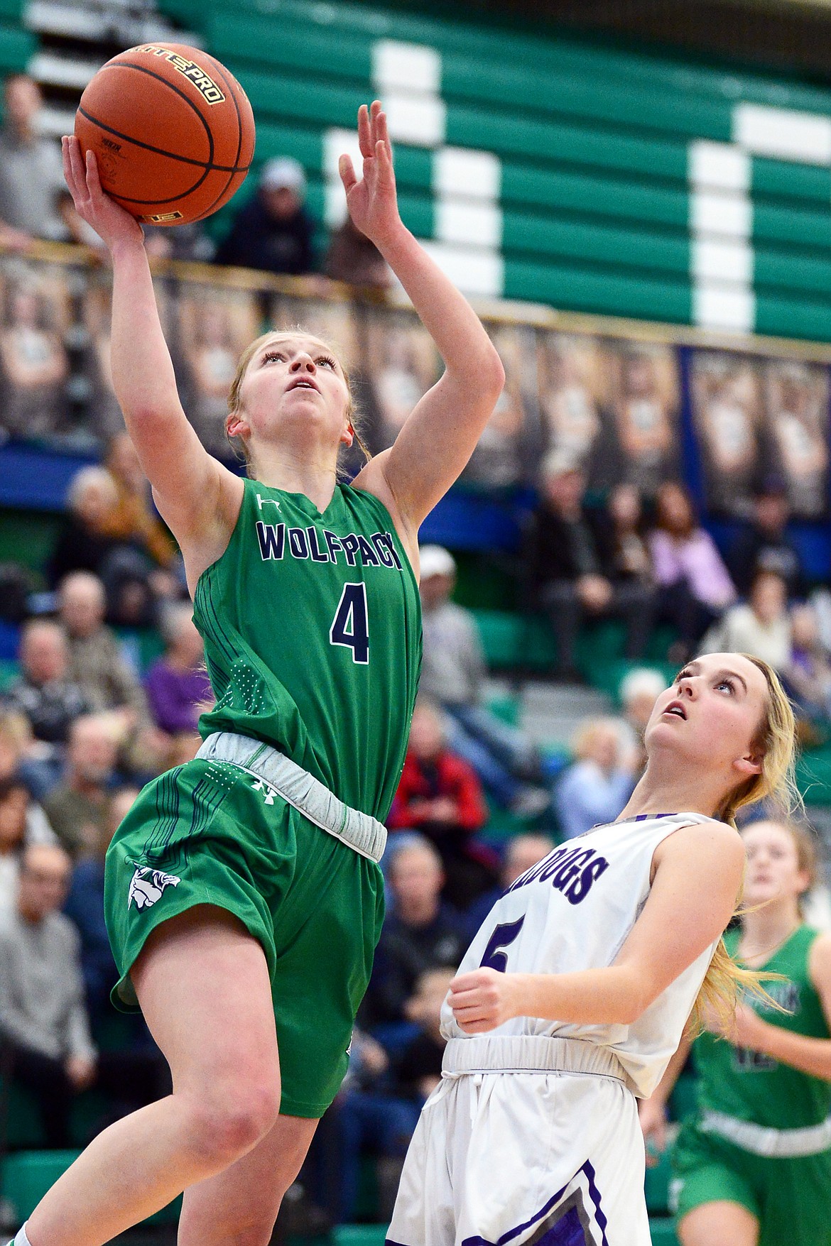 Glacier's Kaylee Fritz drives to the hoop past Butte's Grace McGrath (5) at Glacier High School on Saturday. (Casey Kreider/Daily Inter Lake)