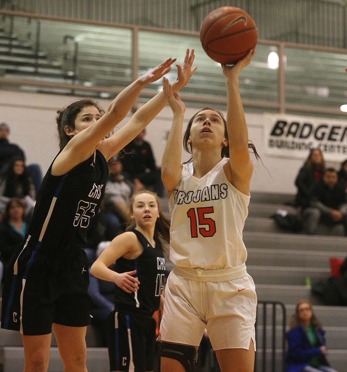 Post Falls' Katie Fleming goes for a layup while defended by Coeur d'Alene's Skylar Burke during Tuesday's game at Post Falls High School. (LOREN BENOIT/Press)