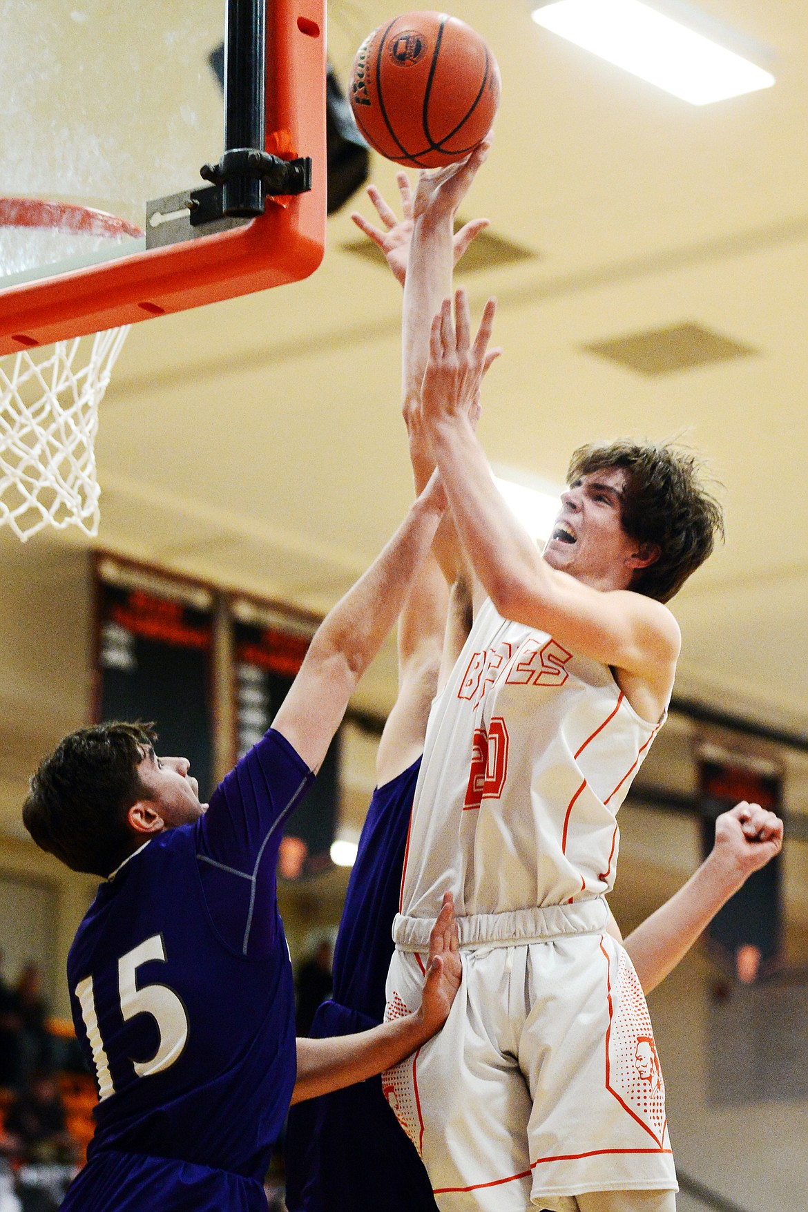 Flathead's Cooper Smith (20) drives to the basket against Butte at Flathead High School on Friday. (Casey Kreider/Daily Inter Lake)