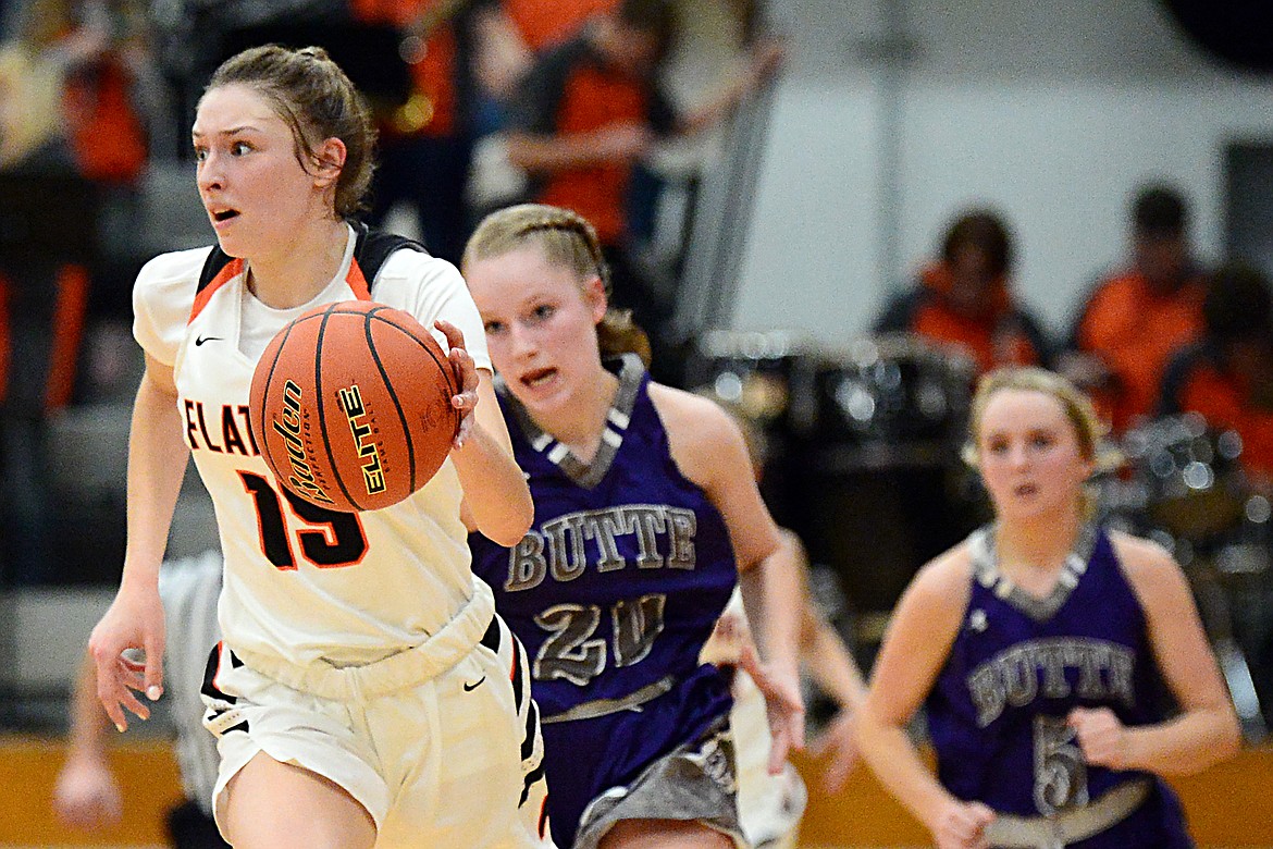 Flathead's Clare Converse (15) brings the ball upcourt against Butte at Flathead High School on Friday. (Casey Kreider/Daily Inter Lake)