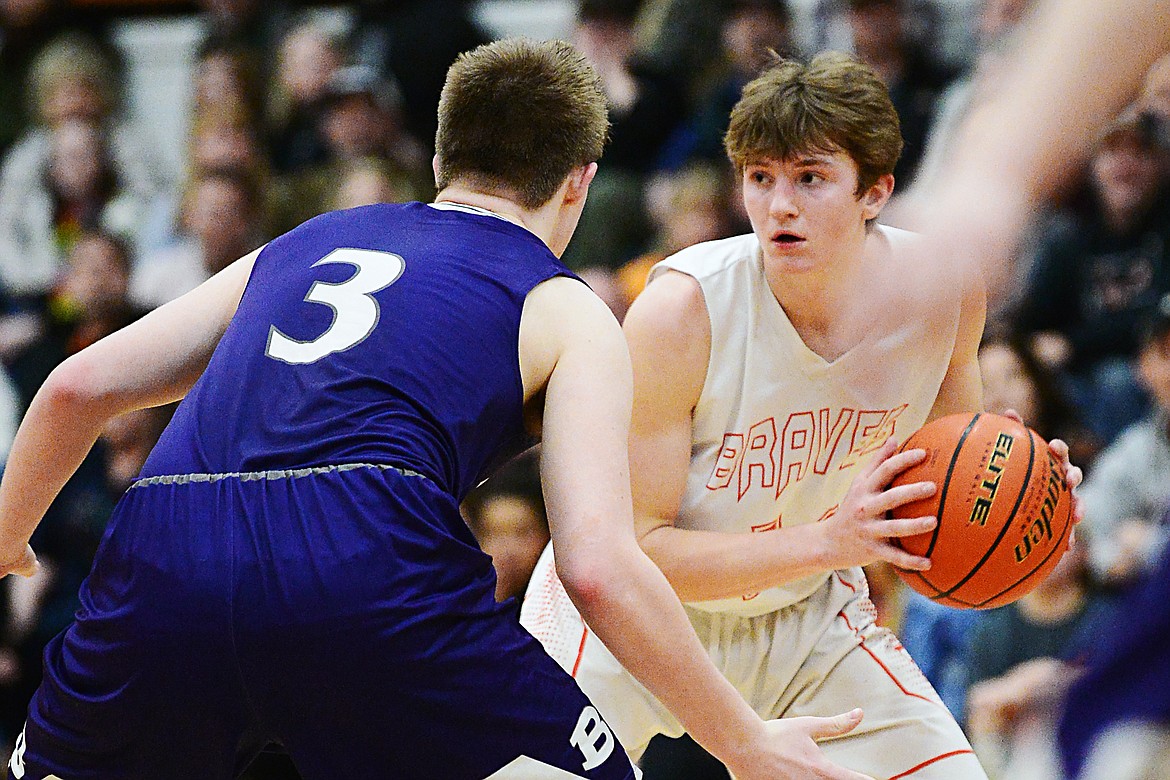 Flathead's Joston Cripe (34) looks for an open teammate in the second half against Butte at Flathead High School on Friday. (Casey Kreider/Daily Inter Lake)