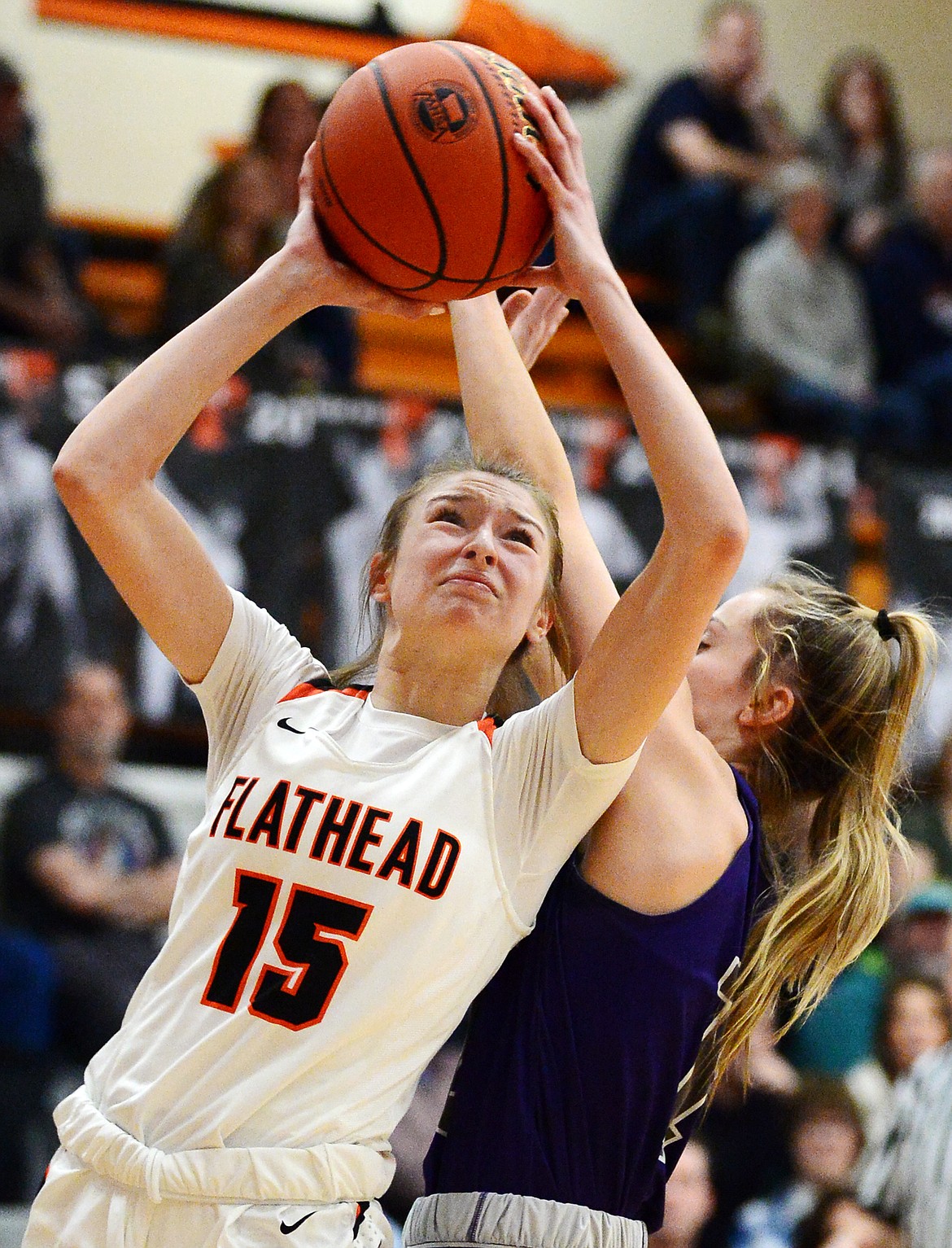 Flathead's Clare Converse (15) drives to the basket against Butte at Flathead High School on Friday. (Casey Kreider/Daily Inter Lake)