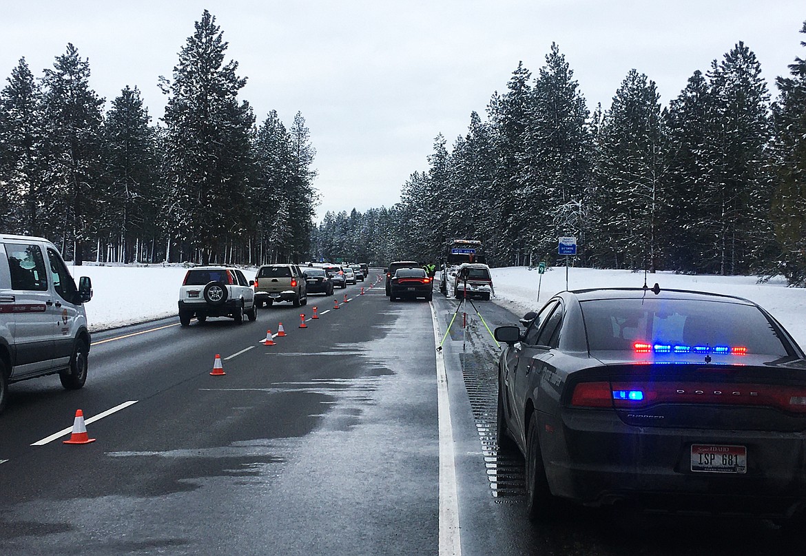 LOREN BENOIT/Press
Idaho State Police respond to an accident on Interstate 90 near milepost 9, where a pedestrian was struck and killed by a truck on the freeway on Monday.