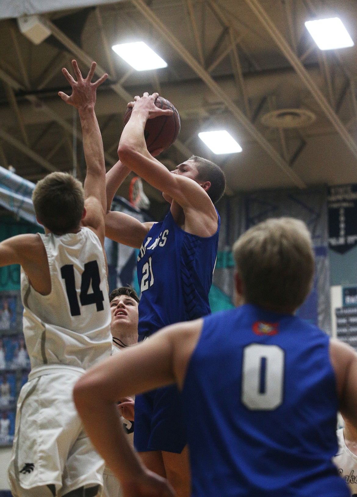 Coeur d&#146;Alene&#146;s Cameren Cope goes for a shot against Lake City&#146;s Kolton Mitchell during Fight for the Fish.