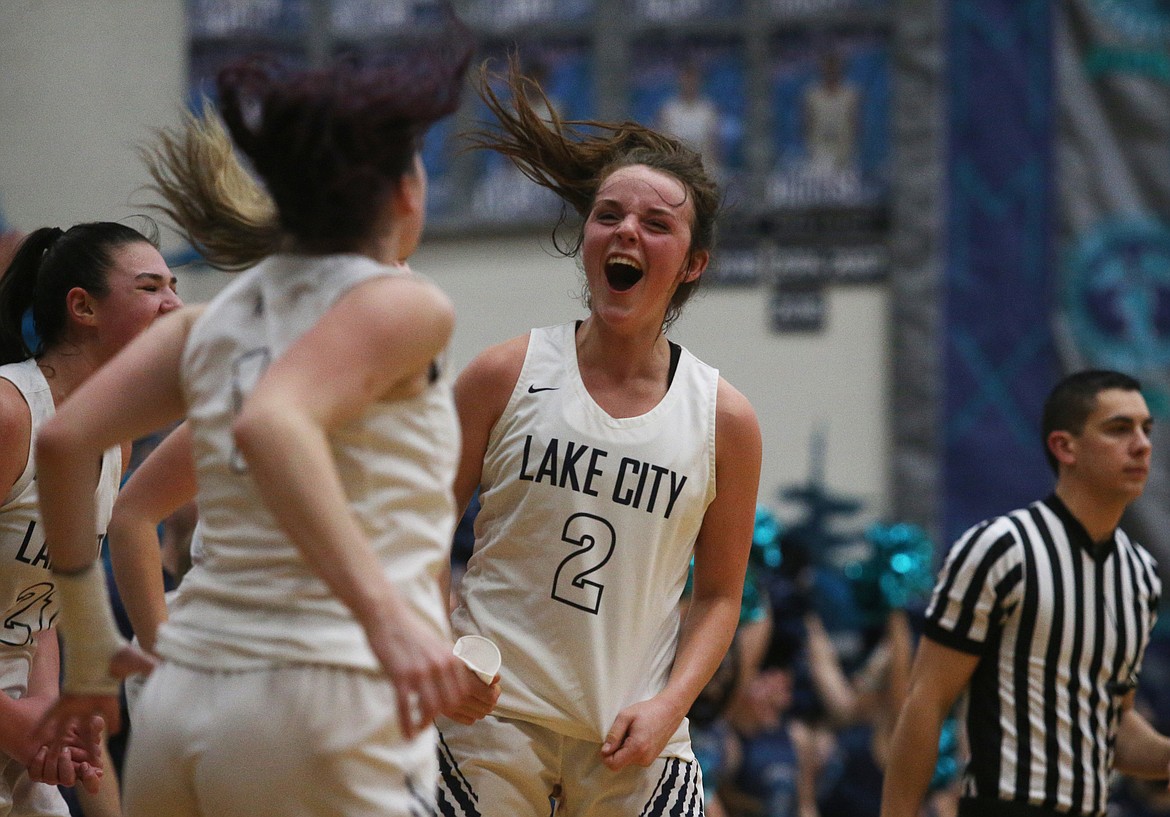 Lake City&#146;s Aubrey Avery celebrates the Timberwolves&#146; win with her teammates after defeating Coeur d&#146;Alene.