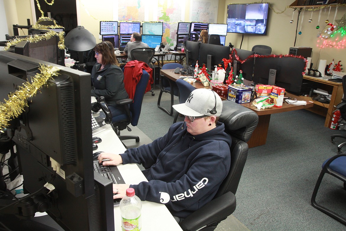 Kootenai County Central dispatchers worked in their temporary basement digs over Christmas as their main dispatch office upstairs in the building on Julia Street was being remodeled. (RALPH BARTHOLDT)