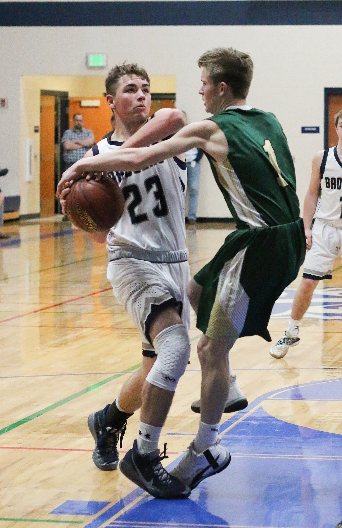 Photo by MANDI BATEMAN 
Dillon Mai fights off a St. Maries opponent during last Thursday's homegame.