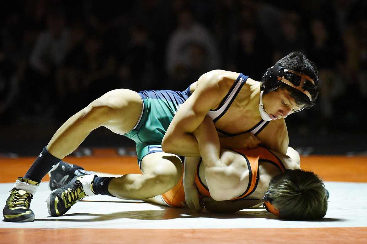 Glacier's Teegan Vasquez wrestles Flathead's Cade Gardner at 113 lbs. at Flathead High School on Friday. Vasquez won by pin. (Casey Kreider/Daily Inter Lake)