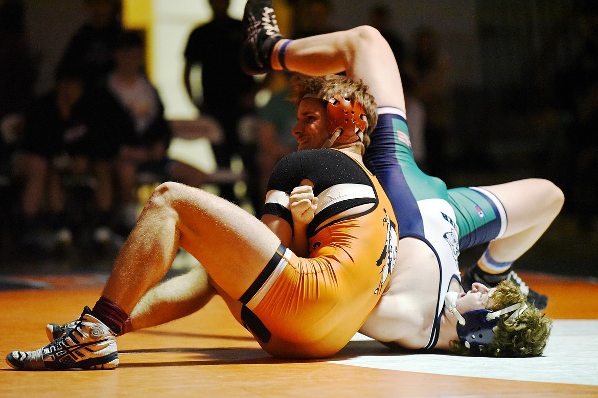 Flathead's Tanner Russell wrestles Glacier's Kael Willis at 170 lbs. at Flathead High School on Friday. Russell won by pin. (Casey Kreider/Daily Inter Lake)