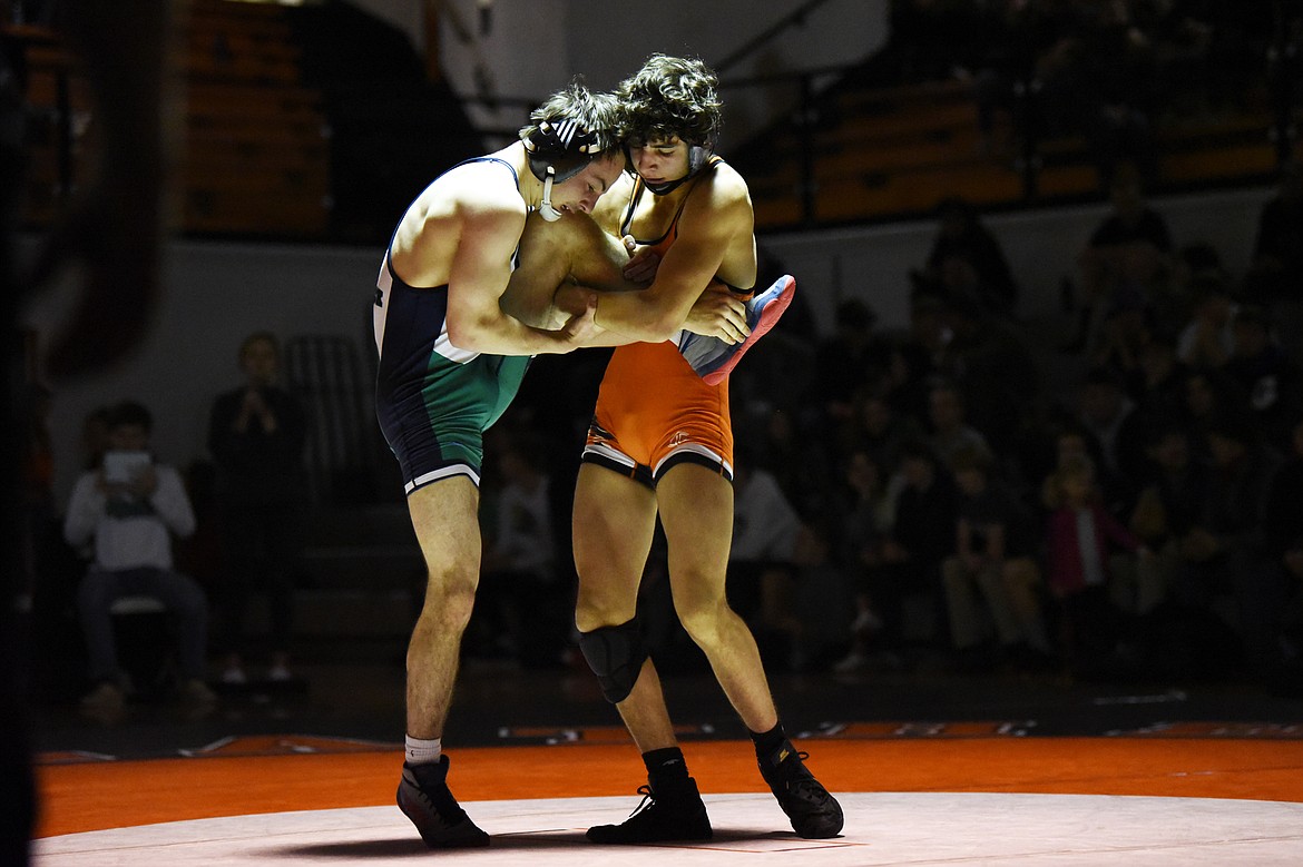 Glacier's Lance Fretwell wrestles Flathead's Asher Kemppainen at 132 lbs. at Flathead High School on Friday. Kemppainen won by decision. (Casey Kreider/Daily Inter Lake)