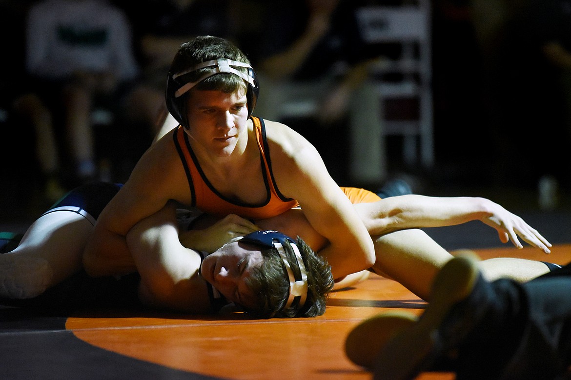 Flathead's Brendan Barnes works toward a pin of Glacier's Ricardo Hewitt at 138 lbs. at Flathead High School on Friday. (Casey Kreider/Daily Inter Lake)