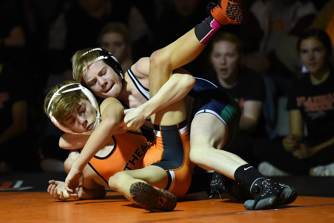 Glacier's Josh Melton wrestles Flathead's Dylan Kratofil at 103 lbs. at Flathead High School on Friday. Melton won by pin. (Casey Kreider/Daily Inter Lake)