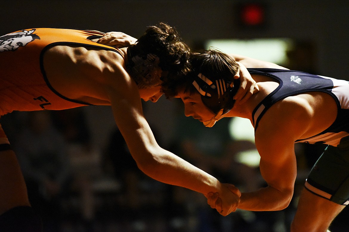 Flathead's Asher Kemppainen wrestles Glacier's Lance Fretwell at 132 lbs. at Flathead High School on Friday. Kemppainen won by decision. (Casey Kreider/Daily Inter Lake)