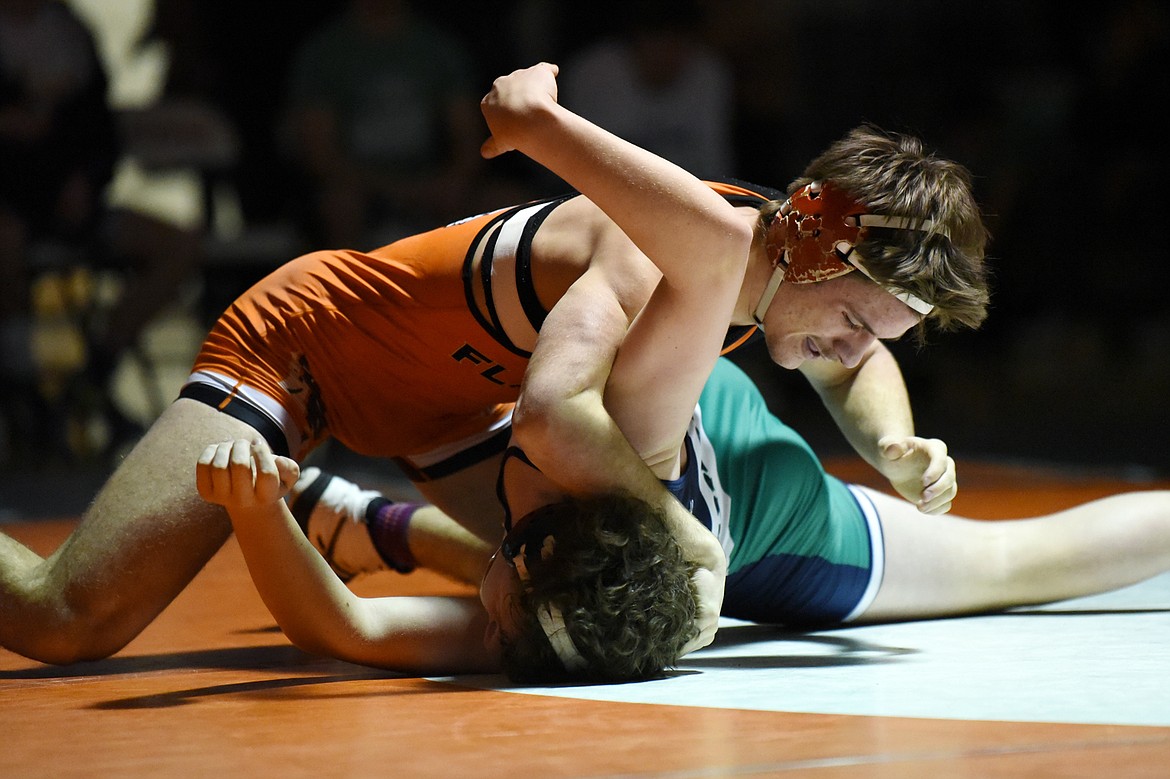 Flathead's Tanner Russell wrestles Glacier's Kael Willis at 170 lbs. at Flathead High School on Friday. Russell won by pin. (Casey Kreider/Daily Inter Lake)