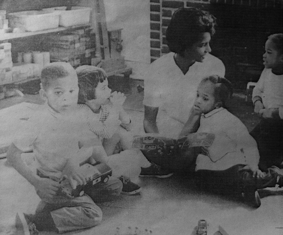 Young students hover around their teacher at the Atlanta Cooperative Preschool, which Ruth and Sam Neff helped found in 1966. (Daniel McKay/Whitefish Pilot)