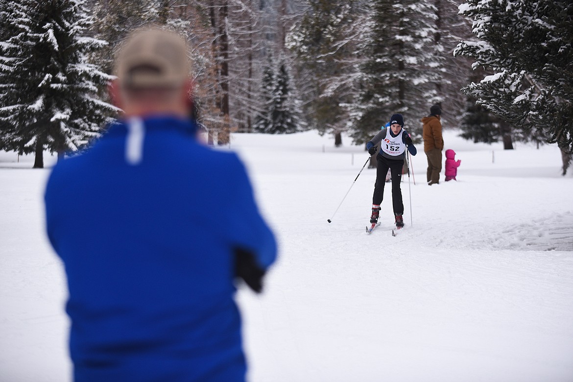 A spectator photographs Greysen Thompson during the Glacier Nordic Club&#146;s Glacier Glide &amp; Pursuit race on Saturday at Whitefish Lake Golf Club. (Daniel McKay/Whitefish Pilot)