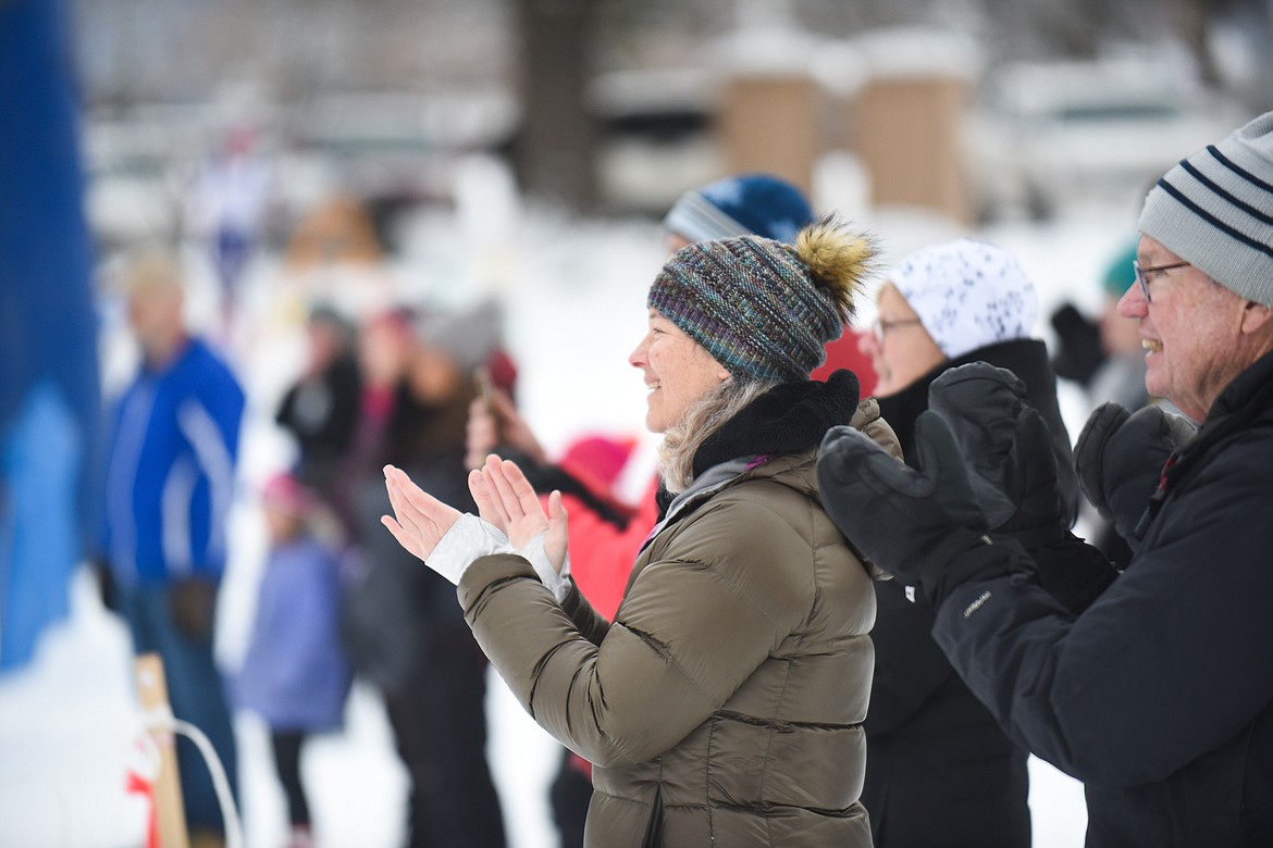 A group of parents and spectators cheer on skiers during the Glacier Nordic Club&#146;s Glacier Glide &amp; Pursuit race on Saturday at Whitefish Lake Golf Club. (Daniel McKay/Whitefish Pilot)