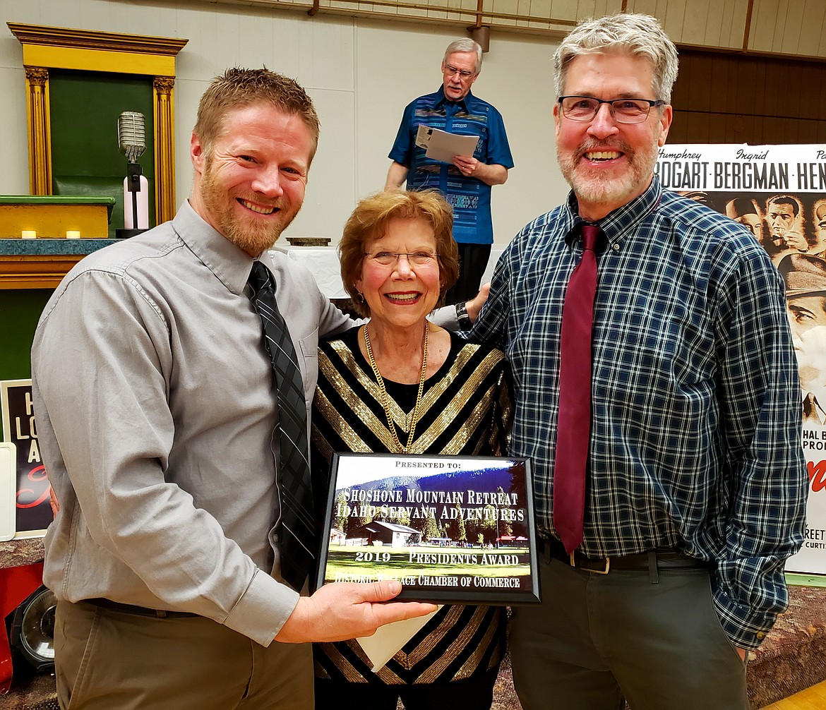 WCC President Anita Price (center) presents the Historic Wallace Chamber President&#146;s Award to Clint Kunze (left) and Bob Baker (right) with Shoshone Mountain Retreat/ Idaho Servant Adventures.