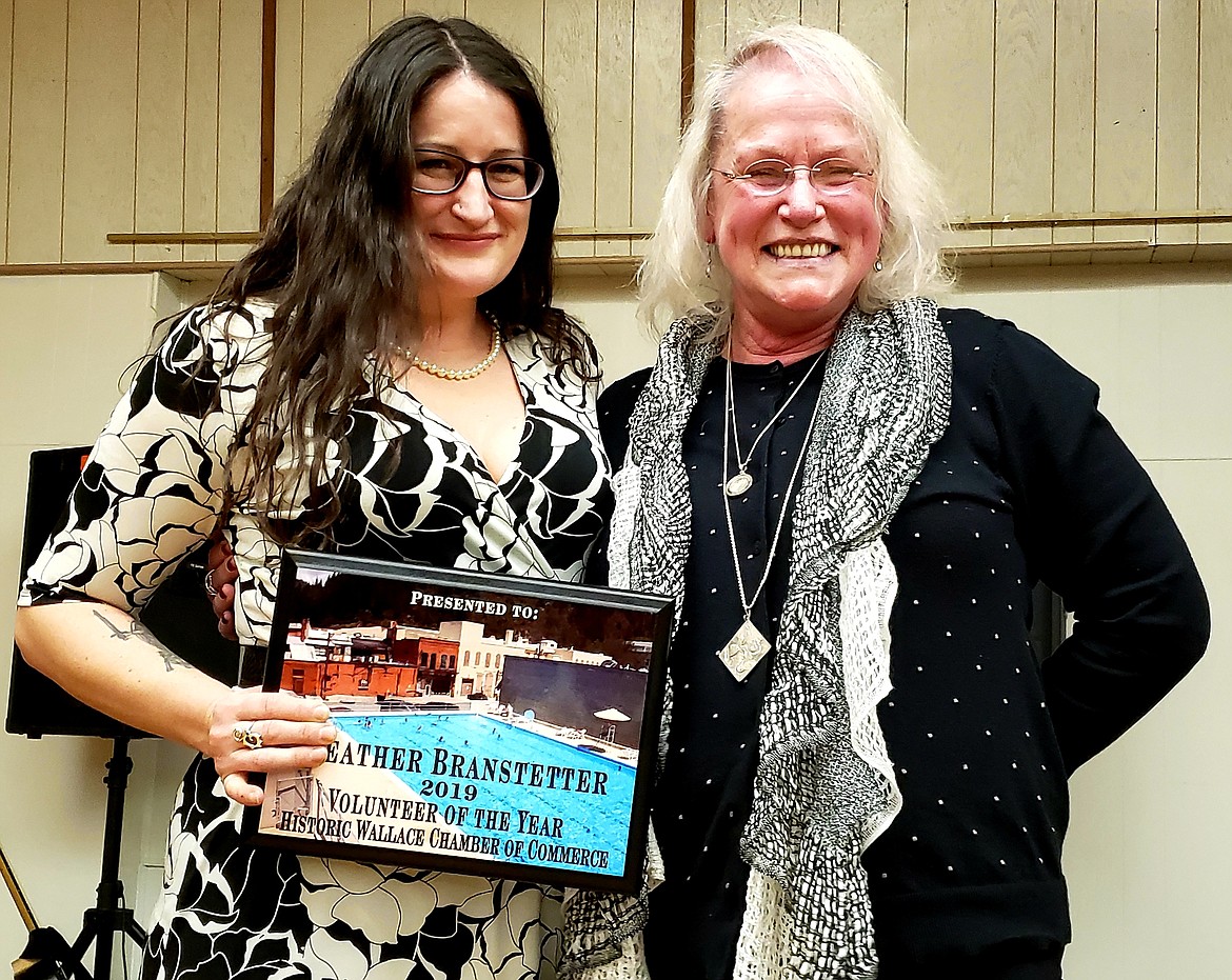Cindy Lien (right) presents the Historic Wallace Chamber Volunteer of the Year award to Heather Branstetter.
