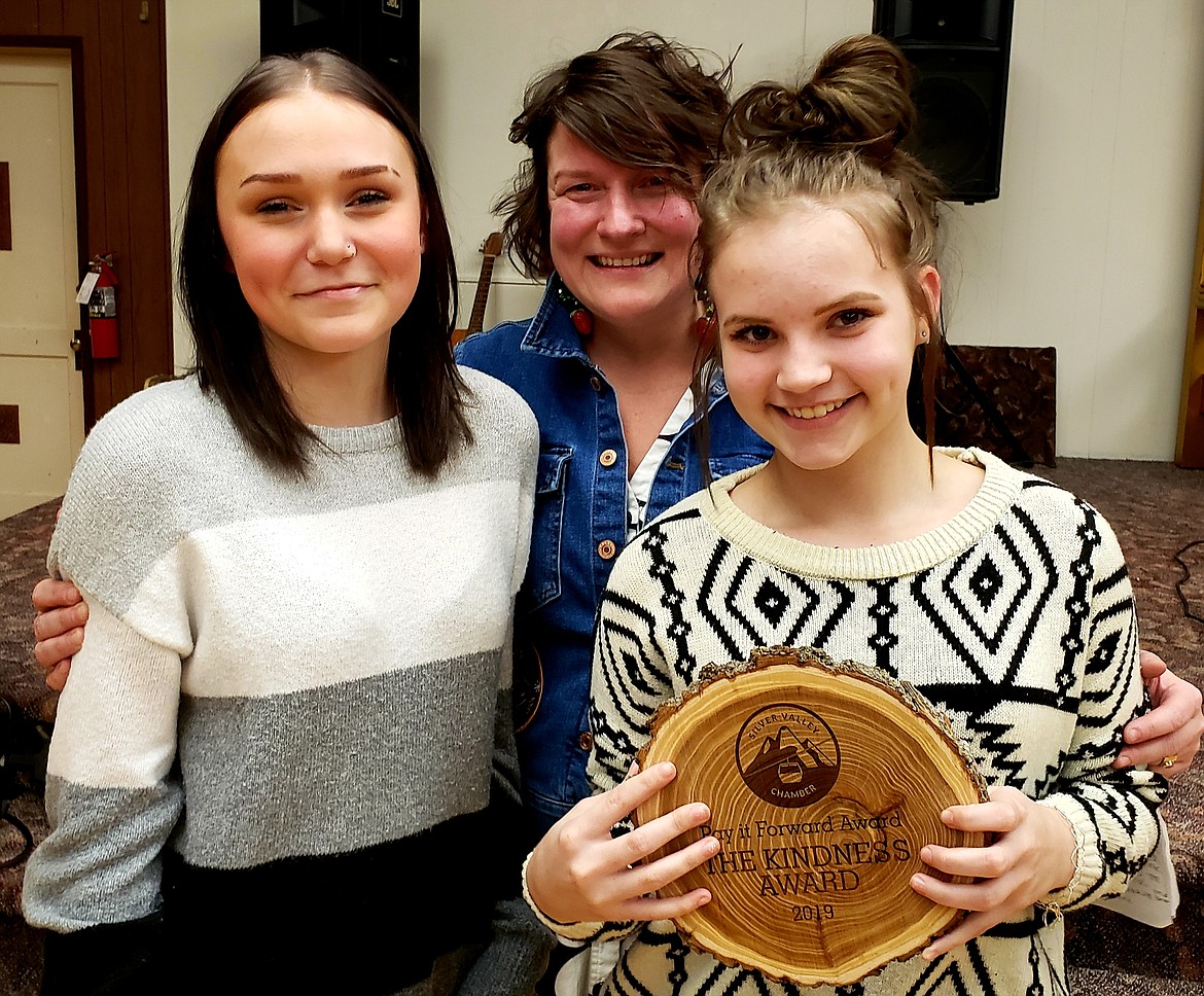 SVCC Past President Sarah Murphy (center) presents the Silver Valley Chamber Pay It Forward award to Sydney Werre (left) and Madi Croston (right) with the Kellogg High School Kindness Club.