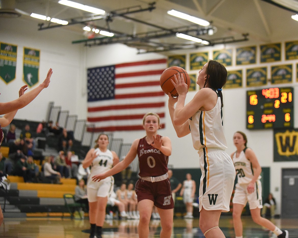 Payton Kastella lines up a corner jumpshot during Saturday's home loss to Hamilton. (Daniel McKay/Whitefish Pilot)