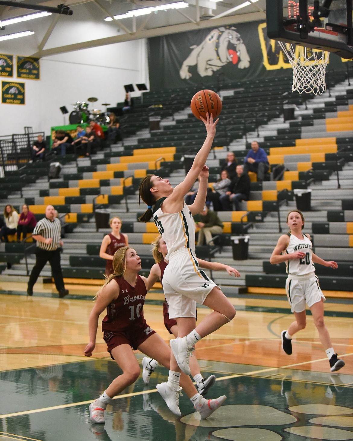 Payton Kastella drives to the basket during Saturday's home loss to Hamilton. (Daniel McKay/Whitefish Pilot)