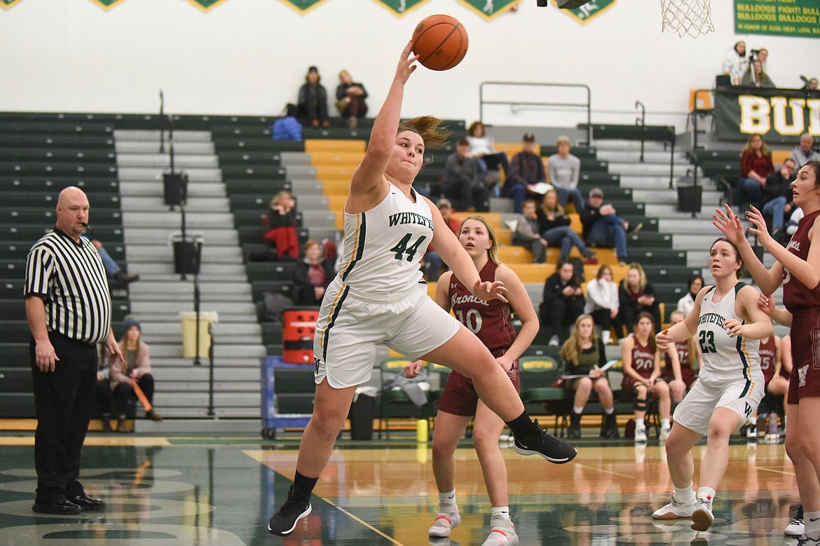 Hope Brown skies for the out-of-bounds save during Saturday's home loss to Hamilton. (Daniel McKay/Whitefish Pilot)