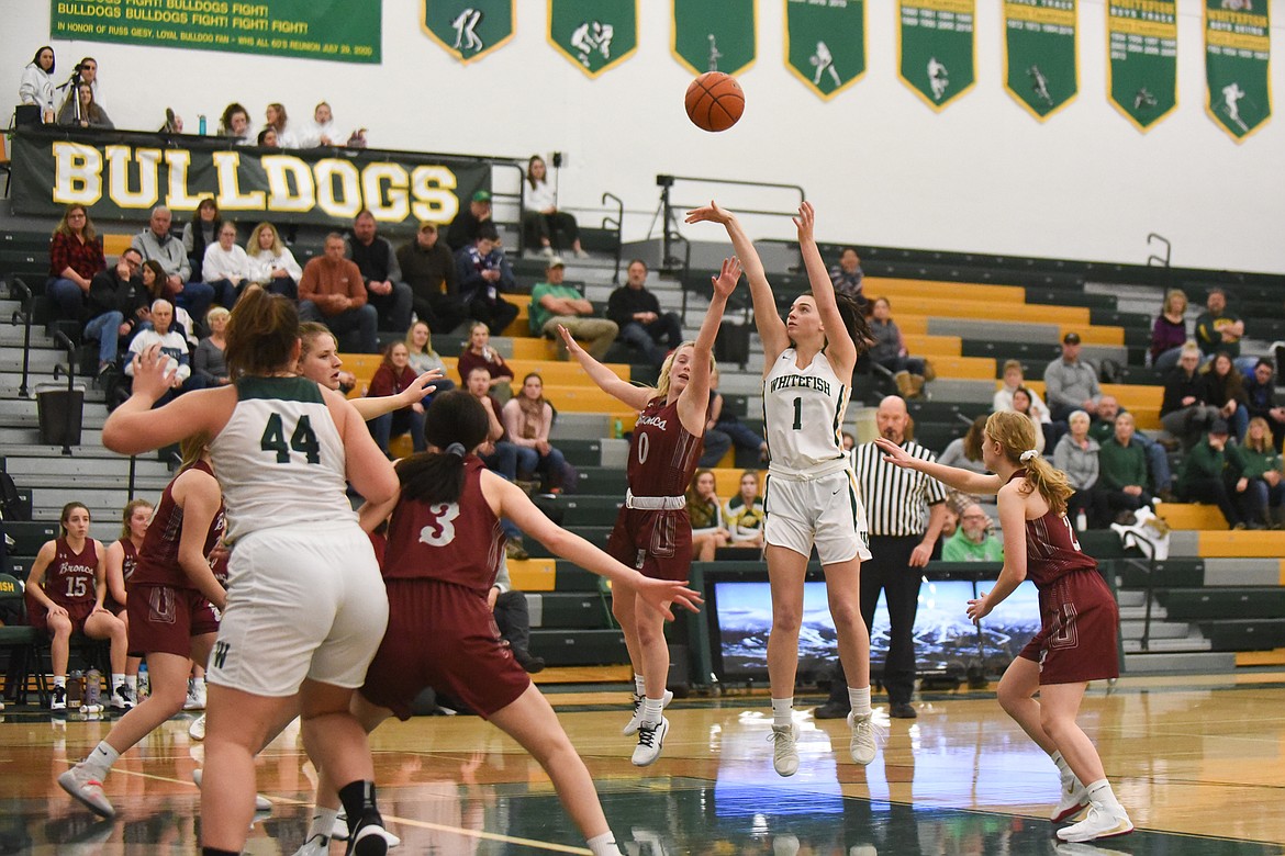 Jadi Walburn launches an elbow jumper during Saturday's home loss to Hamilton. (Daniel McKay/Whitefish Pilot)