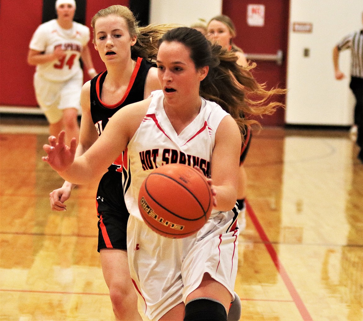 SYDNEY JACKSON running the ball upcourt to score last Friday against Plains. (John Dowd/Clark Fork Valley Press)