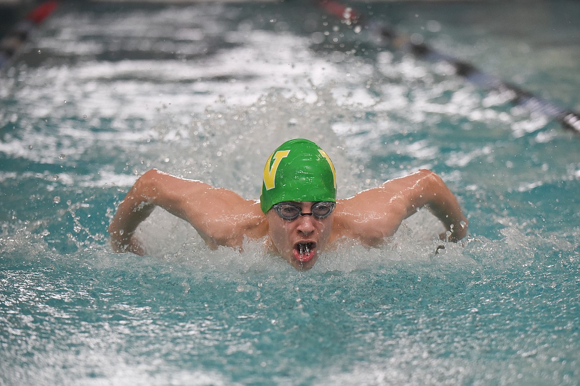 Logan Botner races in the 100m butterfly during the Dog-Cat Invite on Saturday at The Wave. (Daniel McKay/Whitefish Pilot)