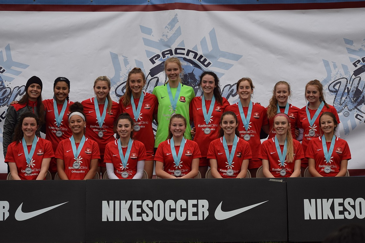 Courtesy photo
The Thorns North FC 02/03 Girls Red soccer team took second place at the Pac NW Winter Classic held in Seattle Jan. 17-20. In game one the Thorns defeated ISC Gunners G02 3-0. All three goals were scored by Lilith Tweedy, with assists by Tierra Lambert and Kali McKellips. In game two the Thorns beat Seattle United G03 ECNL 2-0. Goals were scored by Taytum Curtis, assisted by Abbie Lyman, and Lilith Tweedy. The Thorns tied game three 0-0 against Alaska ADF 02G. In game four the Thorns defeated Pac NW G02 Maroon 2-1. Myah Rietze scored off of a corner kick from Claire Romero in the first half and Pac NW tied it up late in the second half. The game went into a shootout where the Thorns prevailed, advancing to the championship. The Thorns were defeated in the championship game 3-0 by Highline Premier FC G02. In the front row from left are Isabella Henkle, Kali McKellips, Lilith Tweedy, Taytum Curtis, Abbiie Lyman, Tierra Lambert and McKenzie Mattis; and back row from left, coach Becky Thompson, Sophia Allen, Riley Scherr, Myah Rietze, Autumn Lambert, Sydney Harbison, Claire Romero, Samantha Veare and Reagan Hartzell.