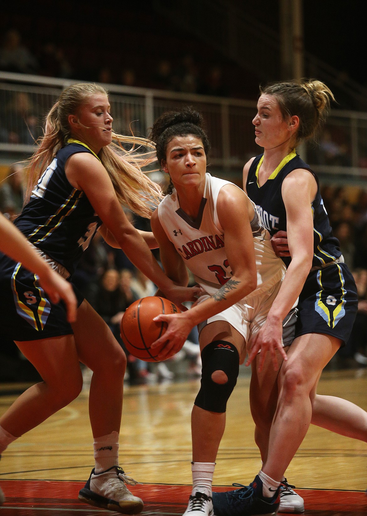 Halle Eborall looks to pass to a teammate while defended by Community College&#146;s of Spokane&#146;s Willow Risinger, right, and Katelyn Ostrowski during Wednesday night&#146;s game at NIC. (LOREN BENOIT/Press)