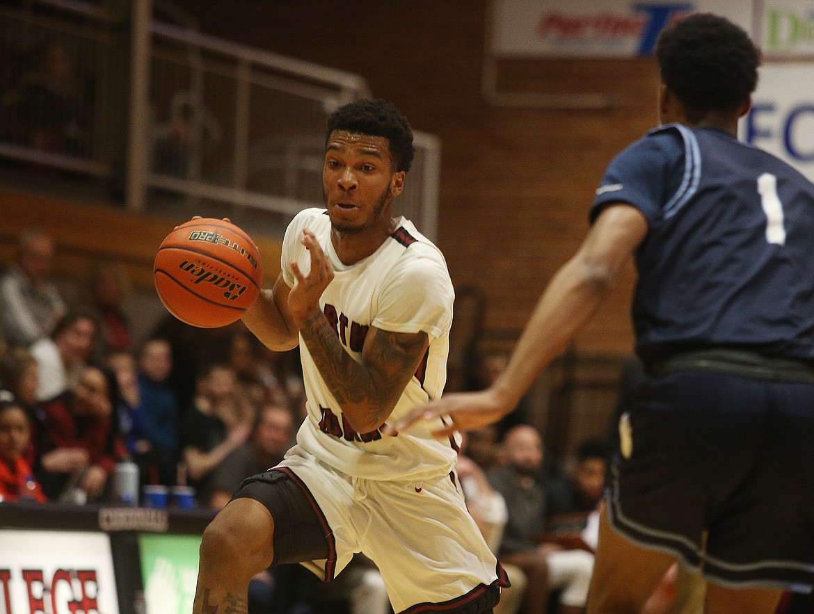 LOREN BENOIT/Press
North Idaho College&#146;s Christian Guess dribbles the basketball in the paint during Wednesday game against Community Colleges of Spokane.