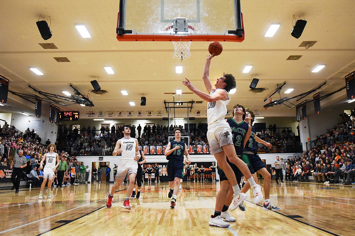 Flathead's Cooper Smith (20) gets to the basket against Glacier in the second half during a crosstown matchup at Flathead High School on Friday. (Casey Kreider/Daily Inter Lake)