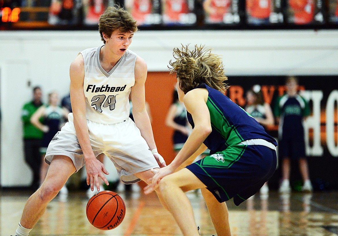 Flathead's Joston Cripe (34) looks to get around the defense of Glacier's Keifer Spohnhauer (2) in the second half during a crosstown matchup at Flathead High School on Friday. (Casey Kreider/Daily Inter Lake)