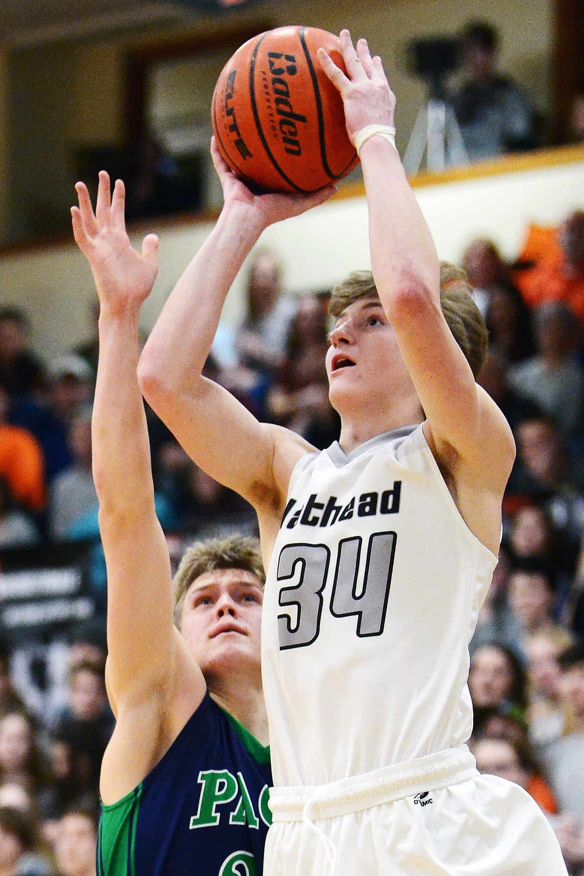 Flathead&#146;s Joston Cripe (34) drives to the basket past Glacier&#146;s Michael Schwarz (22) in the second half during a crosstown matchup at Flathead High School on Friday. (Casey Kreider/Daily Inter Lake)