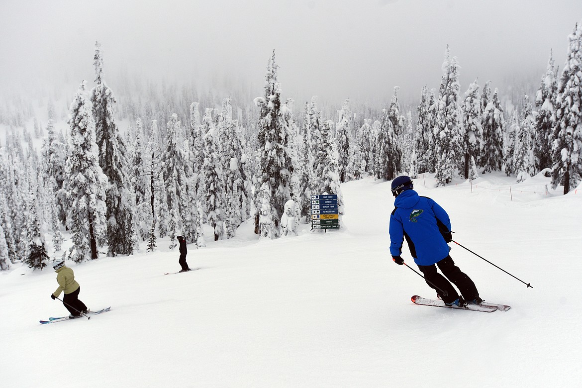 Bill Cubbage, director of snow sports at Whitefish Mountain Resort, skis toward the Goat Haunt slope at Whitefish Mountain Resort.