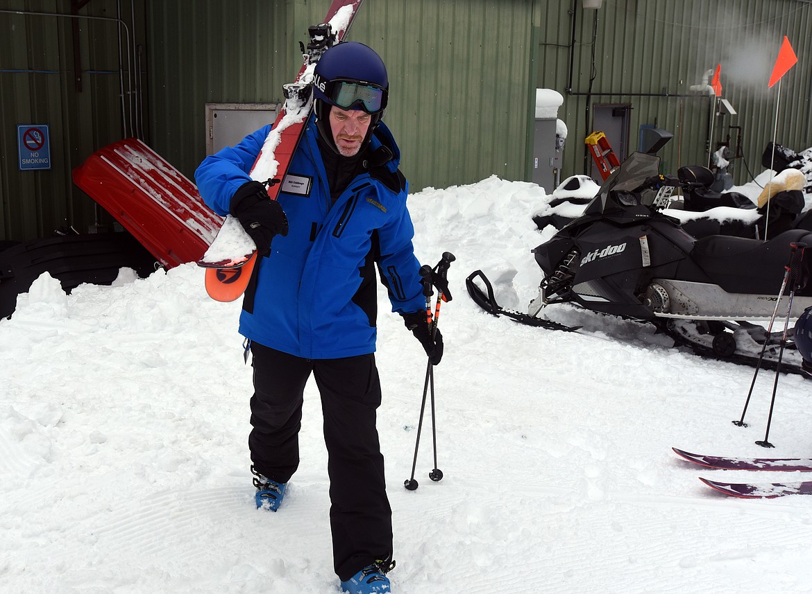 Bill Cubbage heads toward a shop where the resort maintains and repairs its fleet of snowgroomers, snowmobiles and vehicles.