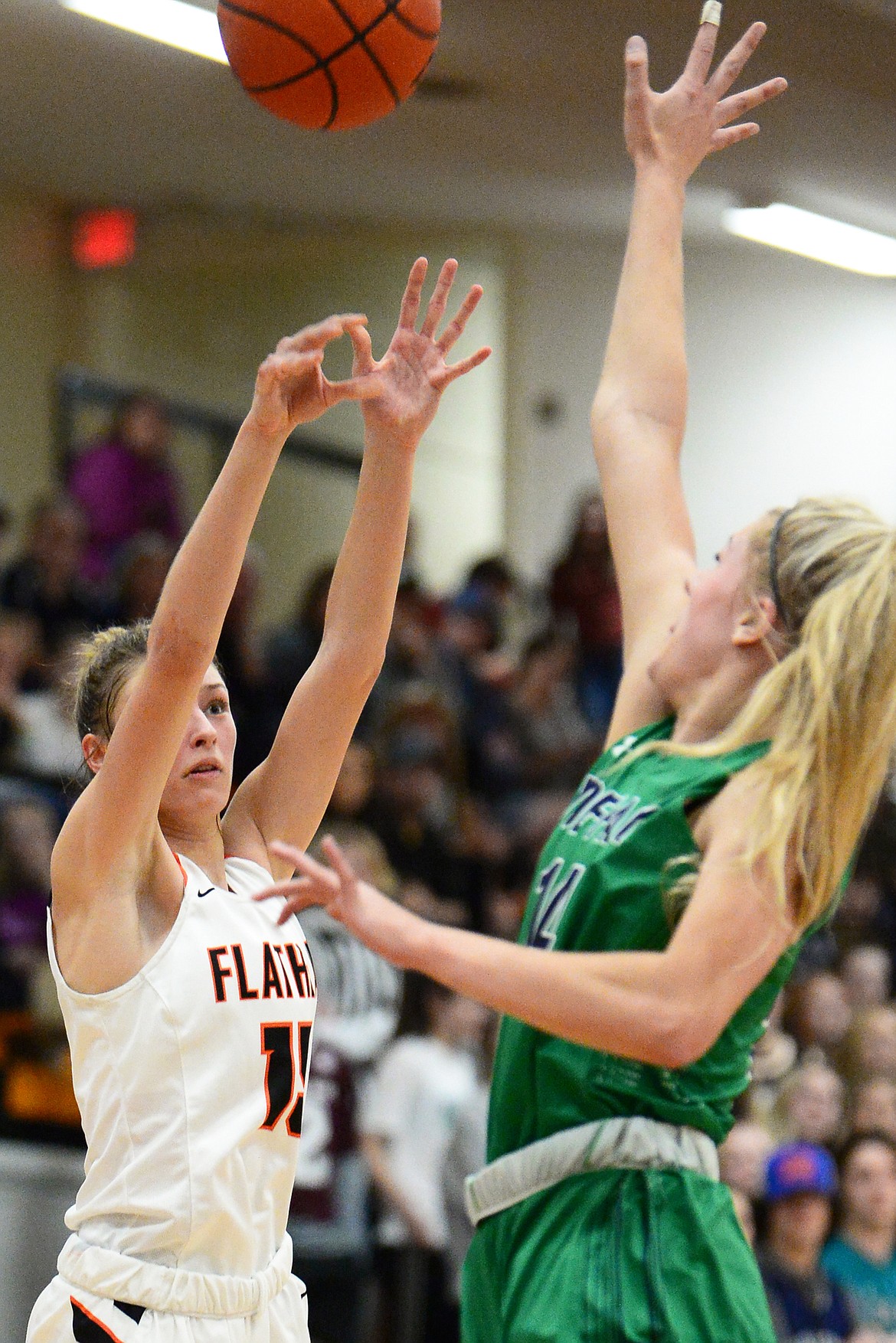 Flathead's Clare Converse (15) looks to shoot against Glacier's Aubrie Rademacher (14) during a crosstown matchup with Glacier at Flathead High School on Thursday. (Casey Kreider/Daily Inter Lake)