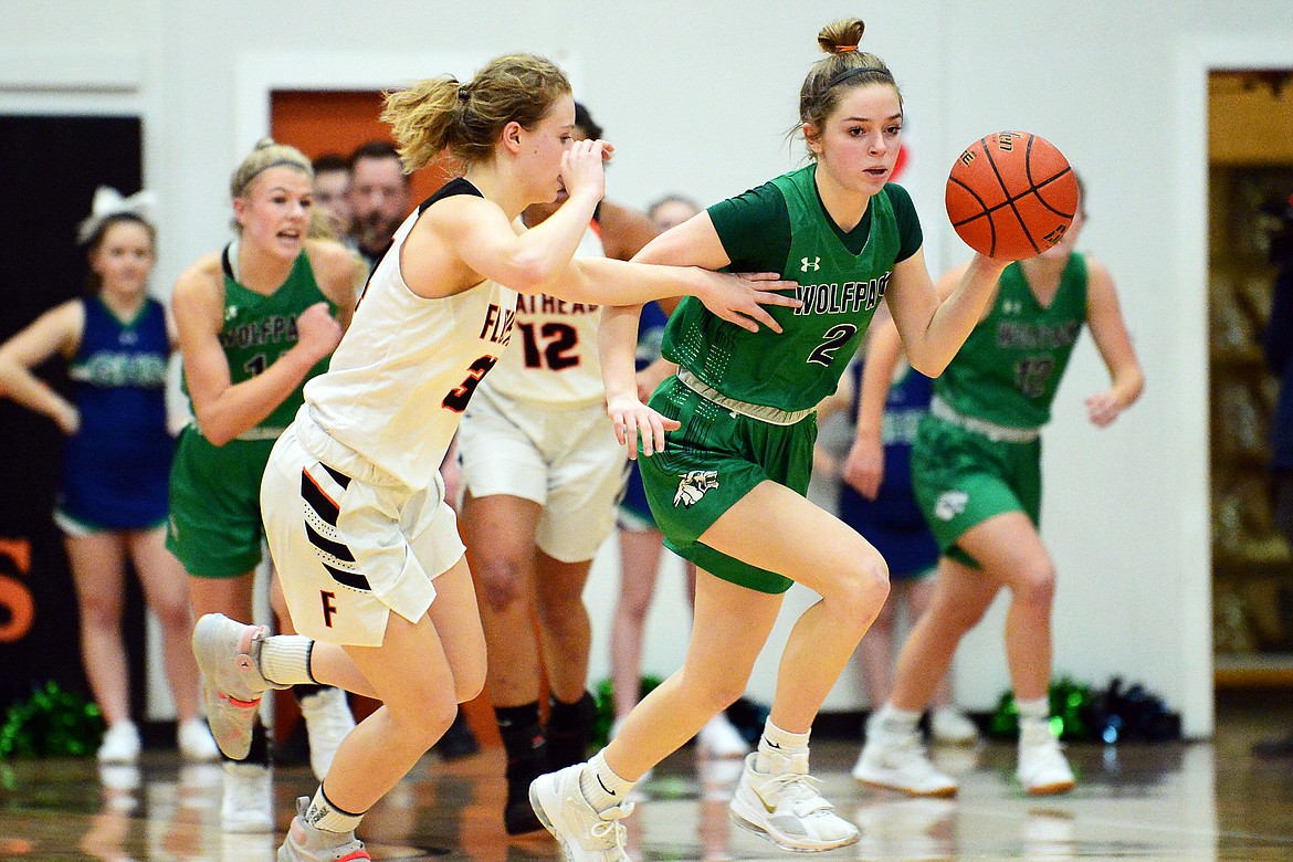 Glacier's Sidney Gulick (2) races up the court after a steal in the first half of a crosstown matchup with Flathead at Flathead High School on Thursday. (Casey Kreider/Daily Inter Lake)