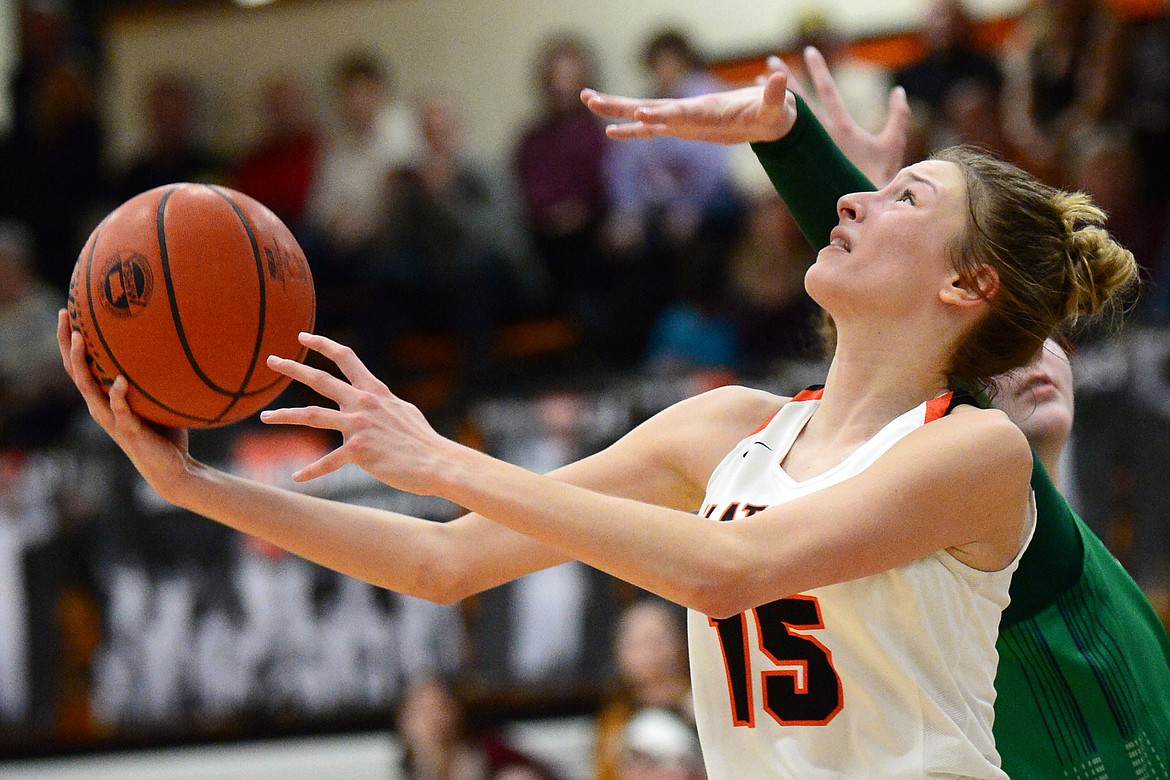 Flathead's Clare Converse (15) looks to shoot under the basket during a crosstown matchup with Glacier at Flathead High School on Thursday. (Casey Kreider/Daily Inter Lake)