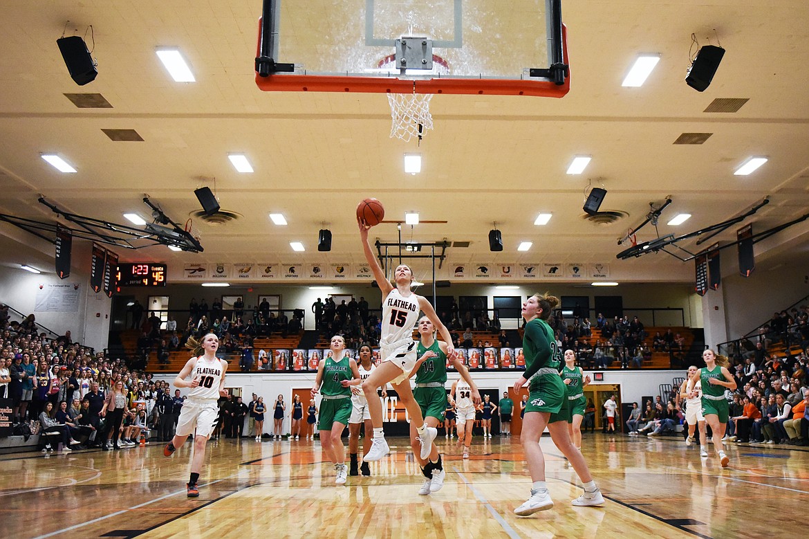 Flathead's Clare Converse (15) drives to the basket against Glacier during a crosstown matchup at Flathead High School on Thursday. (Casey Kreider/Daily Inter Lake)