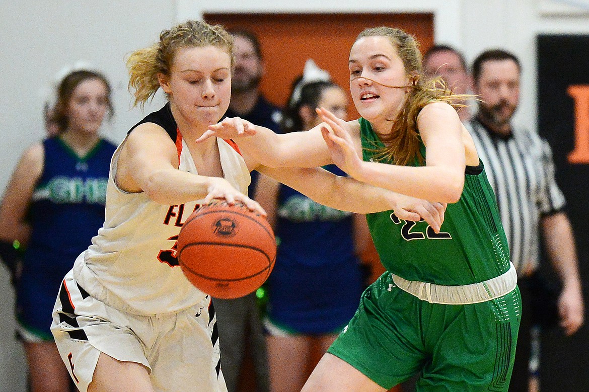 Flathead's Molly Winters (34) and Glacier's Ellie Keller (22) battle for a loose ball in the first half during a crosstown matchup at Flathead High School on Thursday. (Casey Kreider/Daily Inter Lake)