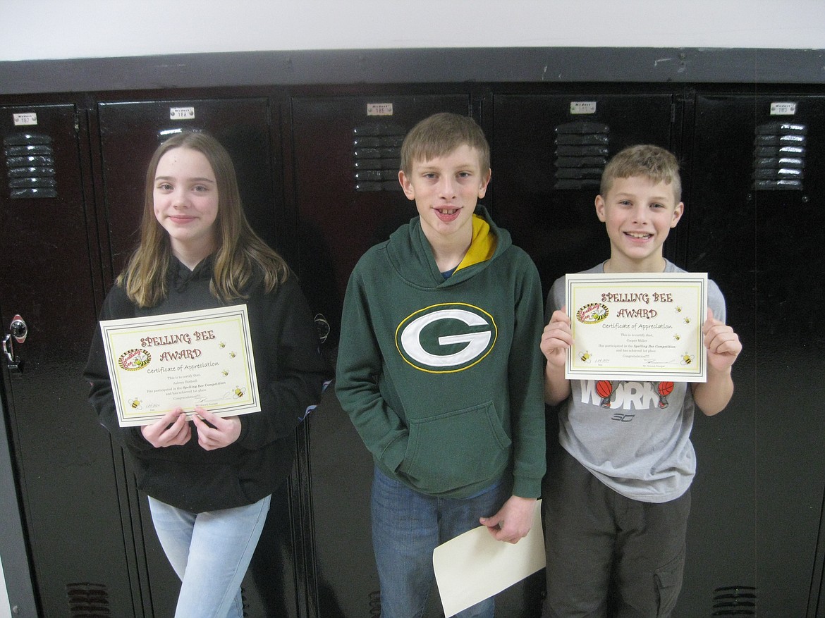 Photo courtesy of TODD HOWARD/
Silver Hills Elementary School spelling champions Aubrey Birdsell (sixth grade), Jackson Wuolle (fifth grade), and Cooper Miller (fourth grade) hold up their certificates after outlasting their classmates in the school bee.
